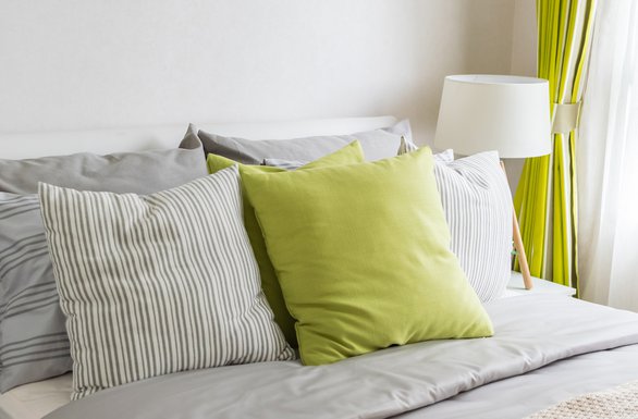 modern-bedroom-with-green-pillow-on-bed-